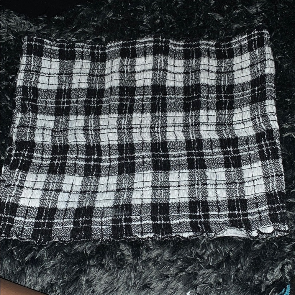 It is in good condition and is a plaid tube top